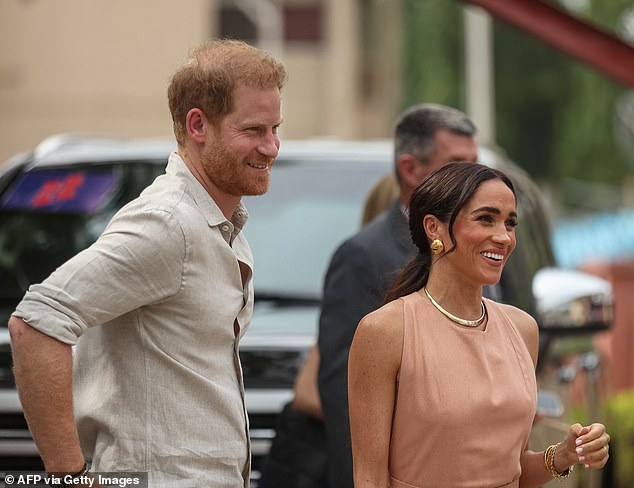 Prince Harry and Meghan Markle arrive at the Wuse Lightway Academy in Abuja this morning