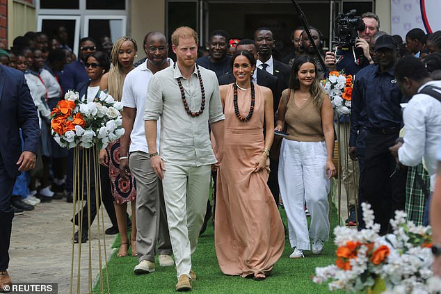 The Duke and Duchess of Sussex are welcomed to the Wuse Lightway Academy in Abuja today