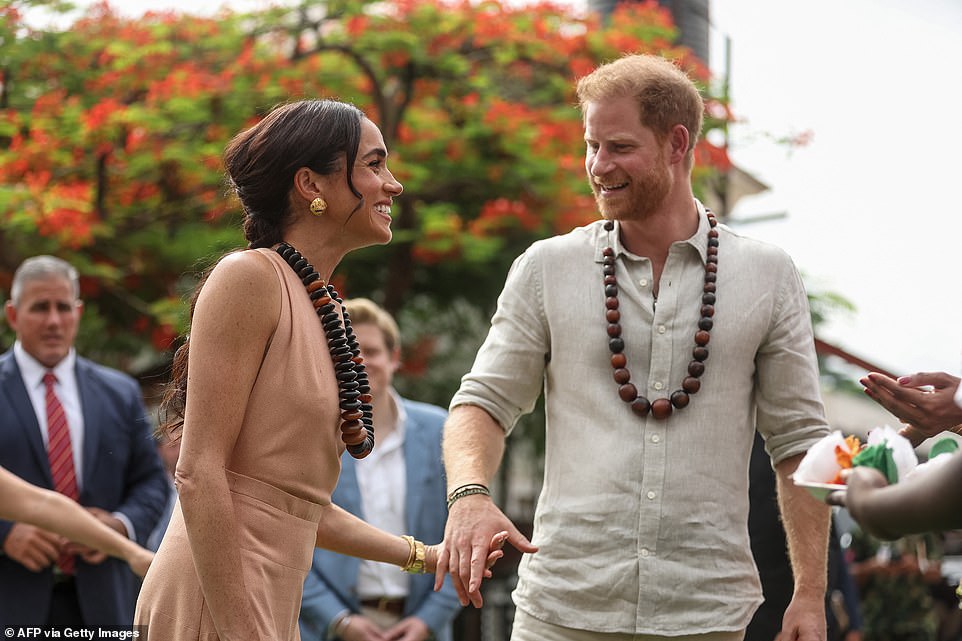 Handing the mic to Meghan, she added: 'Do you see why I married him? He's so smart. And so inspiring because he speaks the truth.' They visited the school about five hours after their arrival in Abuja ¿ before heading onto the Nigerian Defence Headquarters for their next engagement from noon.