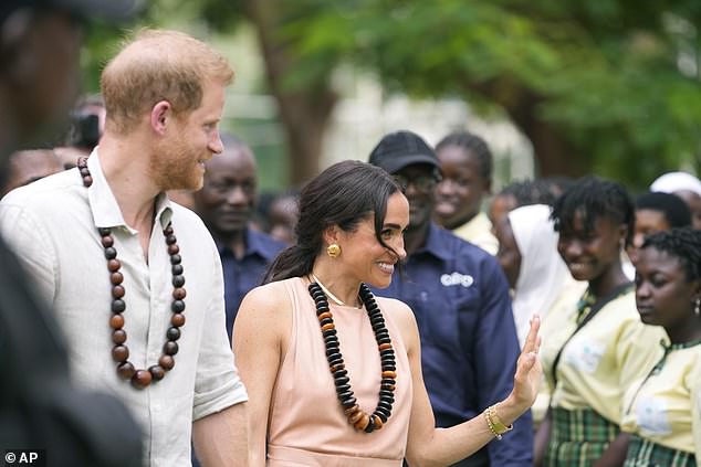 The Duke and Duchess of Sussex are welcomed to the Wuse Lightway Academy in Abuja today