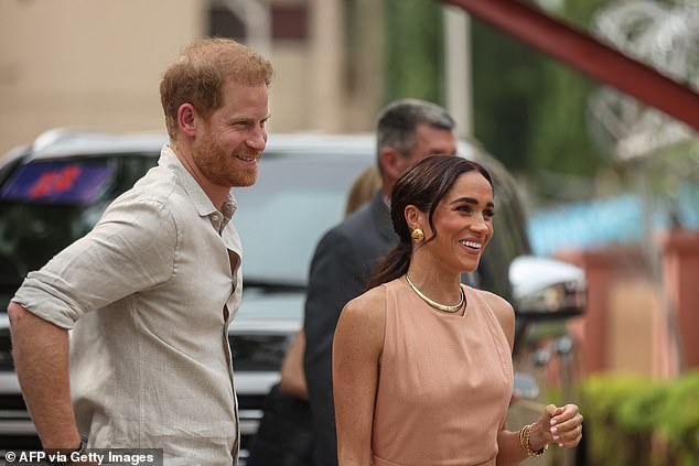 Prince Harry and Meghan Markle arrive at the Wuse Lightway Academy in Abuja this morning