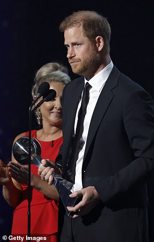 Harry accepted the award at the ceremony despite critics having called for him to turn down the honour - while an online petition was set up condemning the prize