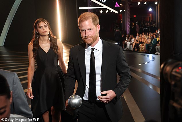 Harry leaves the stage after taking the gong