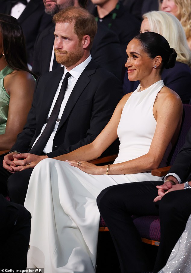 She held her husband's hand at the event as he was up for the prestigious Pat Tillman award - wearing her £5,000 gold Cartier Love Bracelet