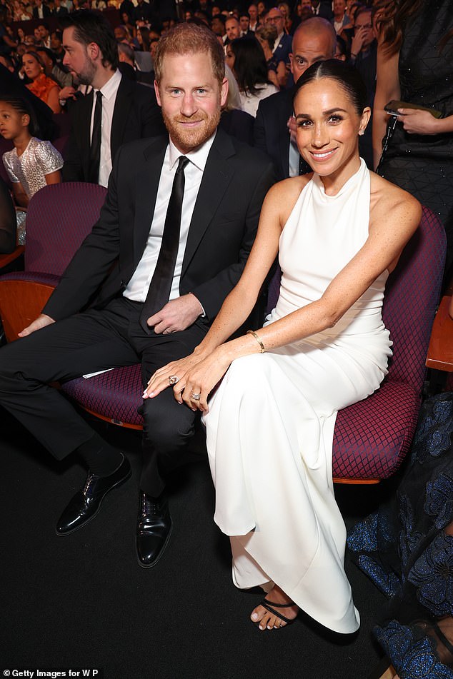 Meghan Markle put on a radiant display in bridal white as she attended the ESPY Awards with Prince Harry on Thursday night