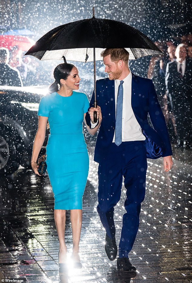 A breathtaking snap of Prince Harry and Meghan on their first post-Megxit appearance in 2020 captured the moment they beamed at each other in the rain