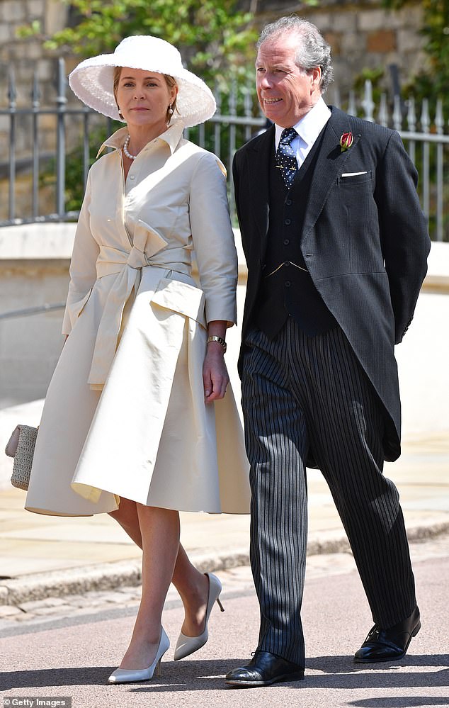 2018: Serena, Countess of Snowdon, places 25th. Above: The Countess wears a cream coat dress and a white wide-rimmed hat as she walks beside her husband David Armstrong-Jones at Harry and Meghan's wedding