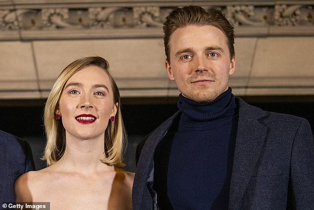 They know Jack about me: Saoirse Ronan says fans usually recognise her beau, Slow Horses heartthrob Jack Lowden (pictured together)