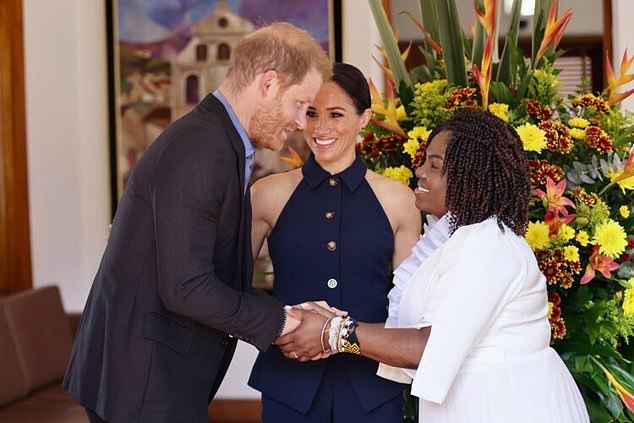 Prince Harry shakes hands with the VP as the Sussexes kick off their four-day trip to Colombia, arriving in the nation's capital today