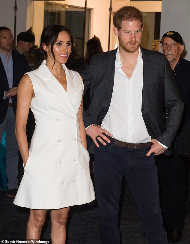 Meghan Markle chats with both hands firmly in her pockets during an official visit to Australia, Fiji, Tonga and New Zealand with Prince Harry in 2018