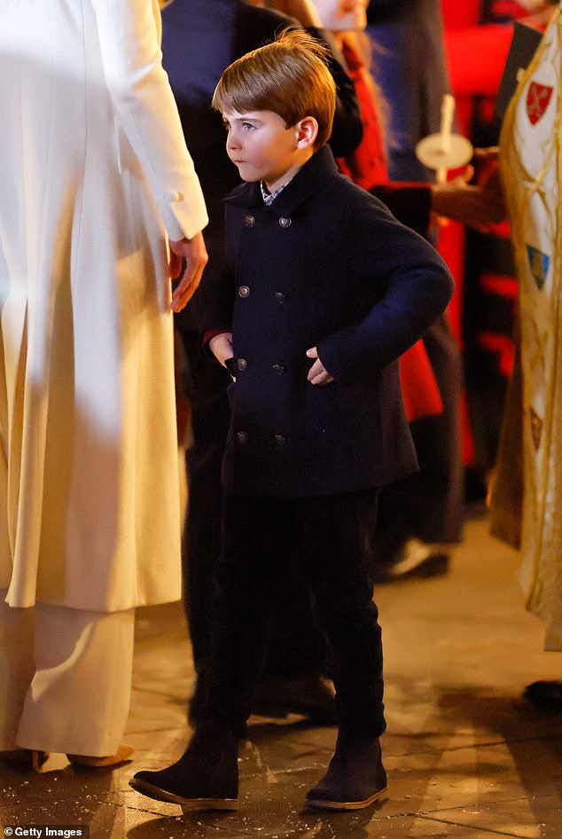 Prince Louis arrives at Westminster Abbey for the Together At Christmas 2023 carol service with his hands in his coat on their way to his pockets