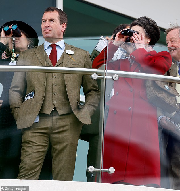 Peter Phillips strikes a casual pose while watching the racing from the royal box at Cheltenham Festival 2024