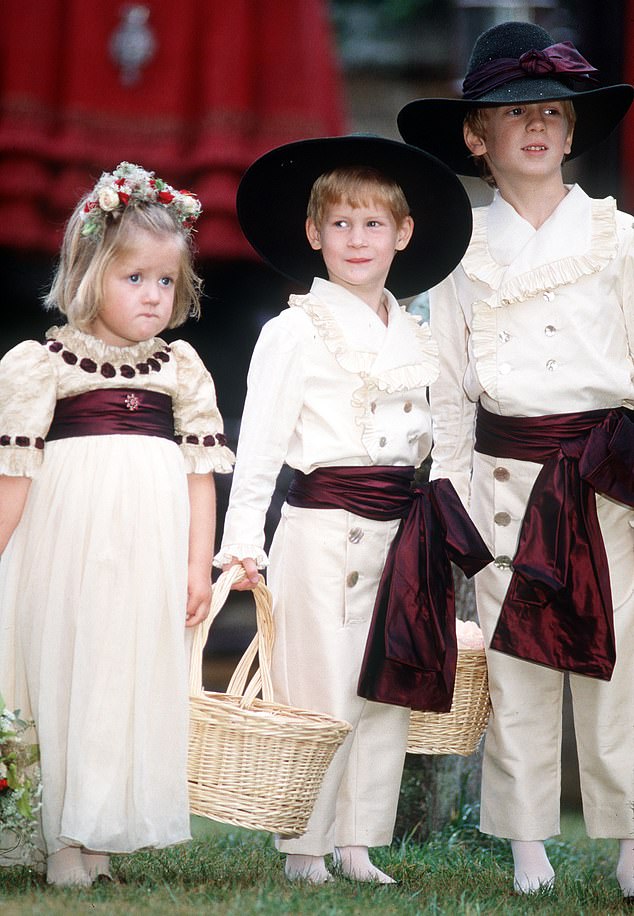 Prince Harry (centre) with Eleanor Fellowes (left) and Alexander Fellowes (right), children of Lord Fellowes, at the wedding of Charles Viscount Althorp to Victoria Lockwood in 1989