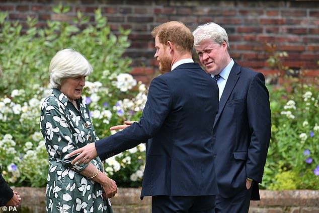 Prince Harry with Lady Jane Fellowes and uncle Earl Spencer at the unveiling of a statue of his mother Diana in the Sunken Garden at Kensington Palace in London in July 2021