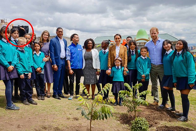 The shield was visible as the couple posed for photos with students at La Giralda school in the Santa Fe district of Bogota