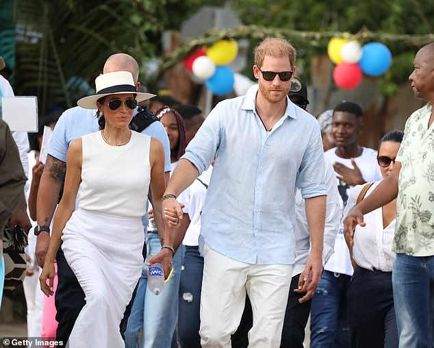 Harry and Meghan are seen on the streets of San Basilio de Palenque during their visit around Colombia