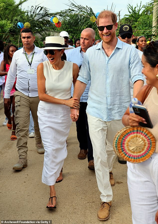 Meghan Markle and Prince Harry looked loved up as they held hands while visiting traditional Afro-Caribbean village, San Basilio de Palenque on Saturday. Sleeveless ribbed top, Argent, £120; linen skirt 'Emma' Posse, £204; shoes, 'Cecilia' Emme Parsons €370; sunglasses, Ray-Ban £155; hat Hannia Char, £100