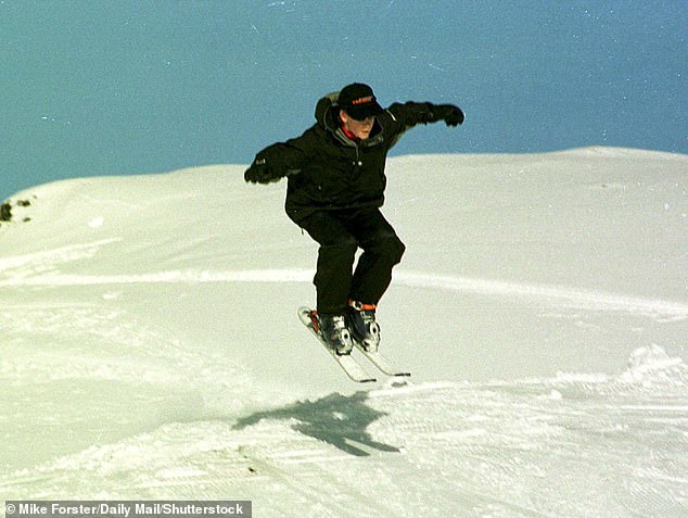 The young prince jumps in the air while skiing in Klosters in January 1999