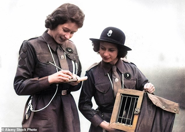 Princess Elizabeth and Princess Margaret sending a message by courier pigeon to Lady Baden Powell at Guide Headquarters, 1943