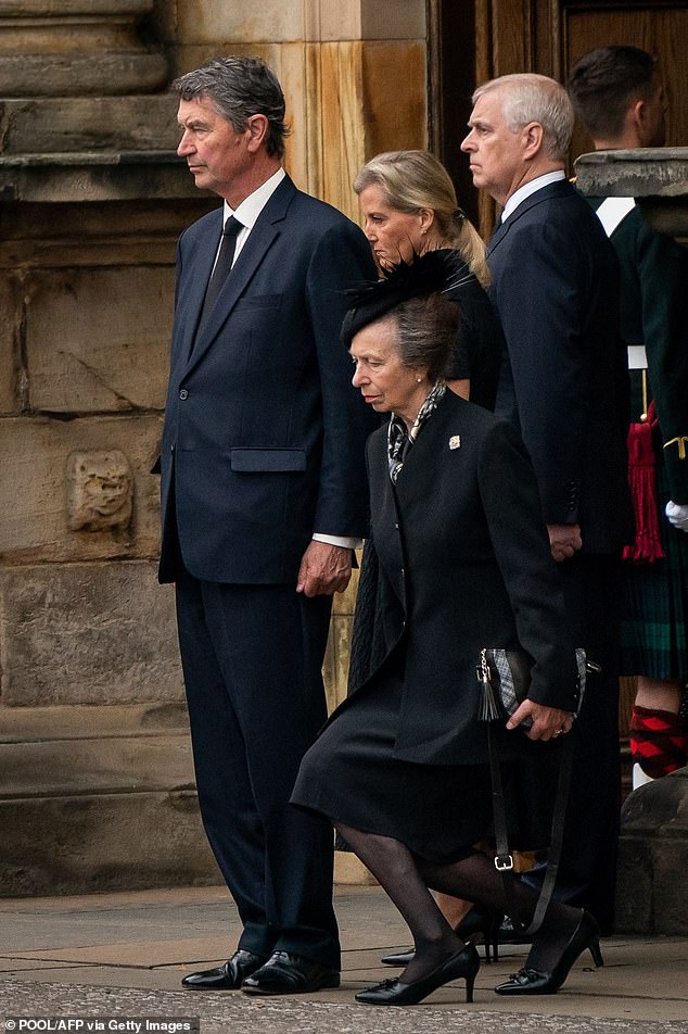 Princess Anne curtsies to the Queen's coffin alongside her husband Timothy Laurence, sister-in-law Sophie, the then Countess of Wessex, and Prince Andrew at the Palace of Holyrood House, September 11, 2022