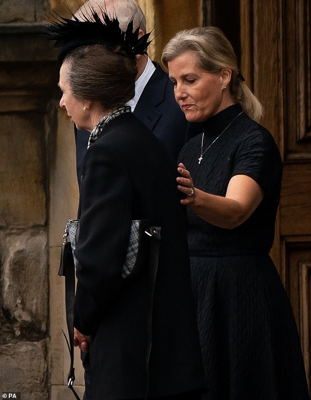 Sophie, then the Countess of Wessex, comforts Princess Anne as they watch the Queen's coffin arrive at the Palace of Holyroodhouse