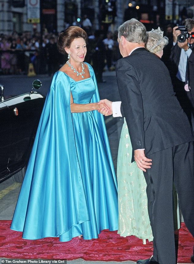 For the Queen Mother's 90th birthday in 1990, Princess Margaret visited the London Palladium wearing a show-stopping caped turquoise gown