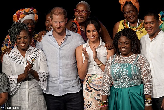 Prince Harry joined his wife Meghan on stage after she spoke at an event focused on empowering Afro-Colombian women