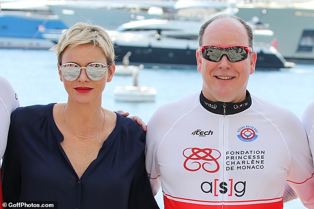 Princess Charlene wearing Dior sunglasses and Prince Albert of Monaco donning a sporty pair of shades in 2017