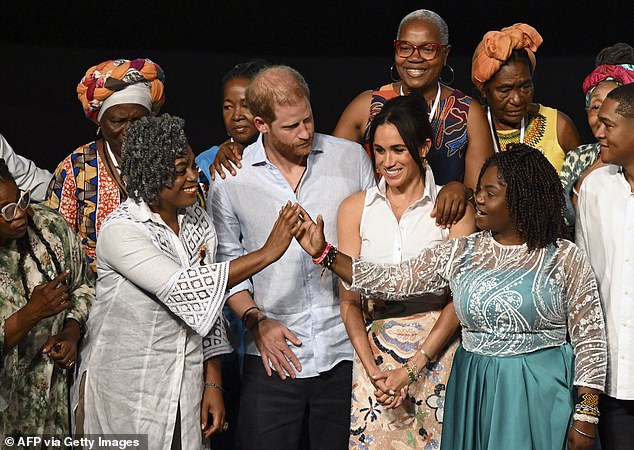 Colombia's Vice President Francia Marquez greets Colombia's former Education Minister Aurora Vergara next to Harry and Meghan