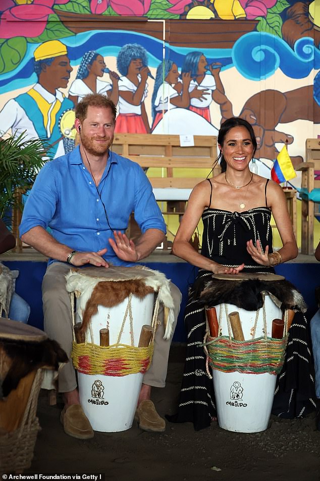 The couple appeared to be wearing earpieces, perhaps to aid translation from Spanish to English, as they took part in the class