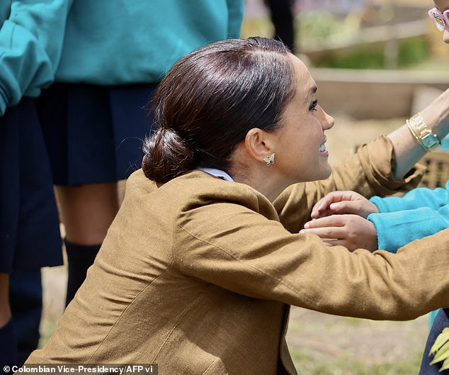 The Duchess added a special touch to her elegant look, donning her mother-in-law Princess Diana's diamond butterfly earrings