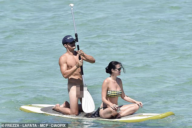 A naked Orlando Bloom paddles with Katy Perry in Sardinia