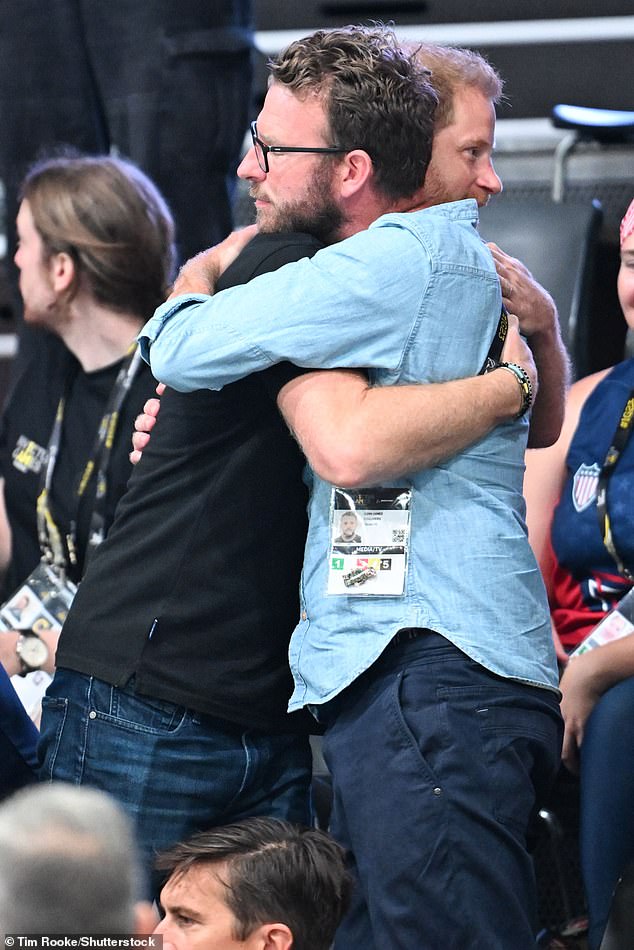 Prince Harry hugs JJ as he arrived to watch wheelchair basketball Invictus Games, in Dusseldorf, Germany