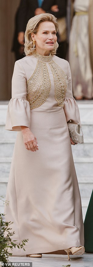 The groom's aunt, Princess Aisha of Jordan, wore the same design to the wedding