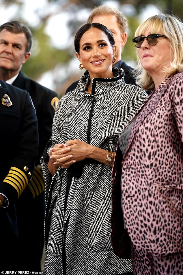 Meghan opted for a sophisticated, chic look, in a monochrome jacket with her hair pulled back 'clean-girl' style at the event last year