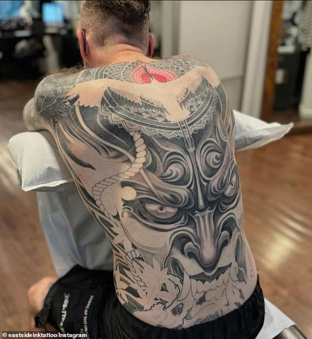 East Side Ink boasts of being one of the oldest tattoo parlors in New York City. Pictured: A back tattoo on another customer