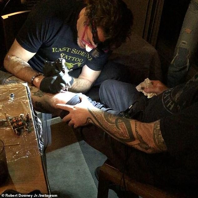 Pictured: Robert Downey Jr getting inked at Lord's studio along with the Avengers cast in 2018