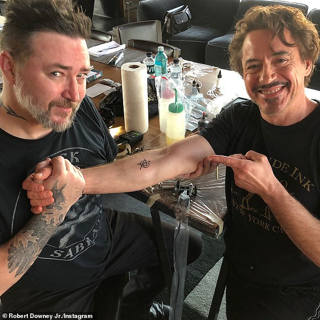 Pictured: Robert Downey Jr getting inked at Lord's studio along with the Avengers cast in 2018