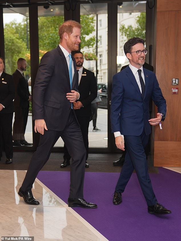 Harry swept into London's Royal Lancaster Hotel to meet children, teenagers and their parents who will be recognised with awards from the charity WellChild