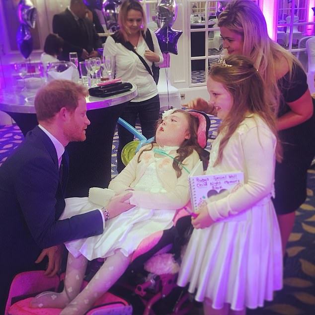 The Duke meeting Ruby and Holly Smallman and their mother Hayley at the awards in 2015