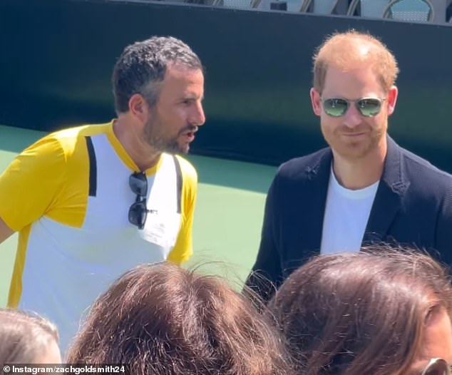 The Duke of Sussex appeared in high spirits as he chatted to LA-based real estate agent Zach Goldsmith (pictured left) at the George Zajfen Tennis Tournament on Saturday