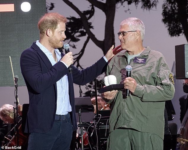 Prince Harry honors a Santa Barbara helicopter pilot at Kevin Costner's One805Live! event