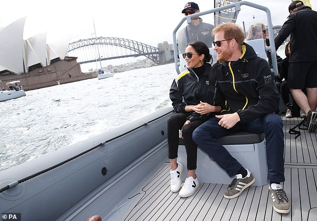 Meghan watching the sailing event at the Invictus Games in Sydney wearing Veja trainers. She turned them into the third hottest product according to Lyst