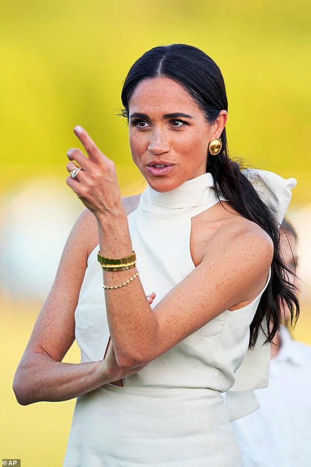 Meghan looked immaculate in a £421 ivory silk-hemp dress by sustainable California-based label Heidi Merrick as she watched a polo competition in Florida in April