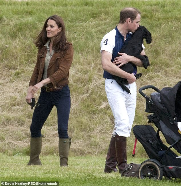 William holding the pooch, who was a wedding gift to the couple, at Beaufort Polo Club in 2012