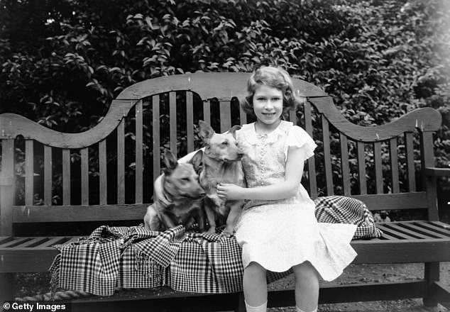 Princess Elizabeth sat with two corgis at her parents' London home, 145 Piccadilly. She was given her first dog when she was seven years old