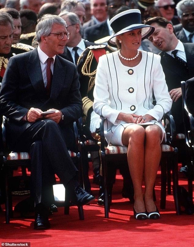 In his biography of Sir John, Anthony Seldon writes that the PM offered advice to Charles and Diana but that it was 'to no avail'. Above: Sir John and Princess Diana observe VJ Day celebrations in London in 1995