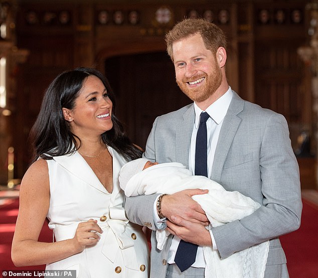 Harry and Meghan with Archie for his first public photograph at Windsor Castle in May 2019