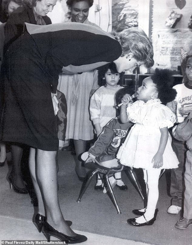 The princess talking to a child in Henry Street Settlement during her solo trip in 1989