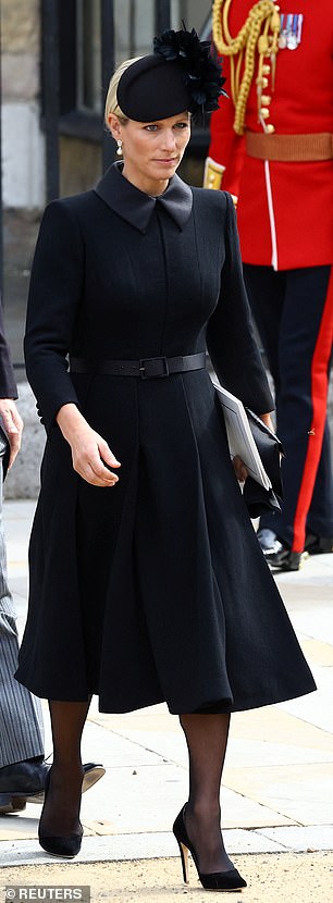 Zara Tindall wore a fit-and-flare coat by Laura Green, complete with a waist belt and duchesse-satin collar, paired with a Juliette Millinery floral hat and Emmy London suede pumps